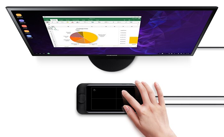 Galaxy S9 or S9+ with a spreadsheet on-screen sliding onto Samsung DeX Pad in front of a Samsung monitor