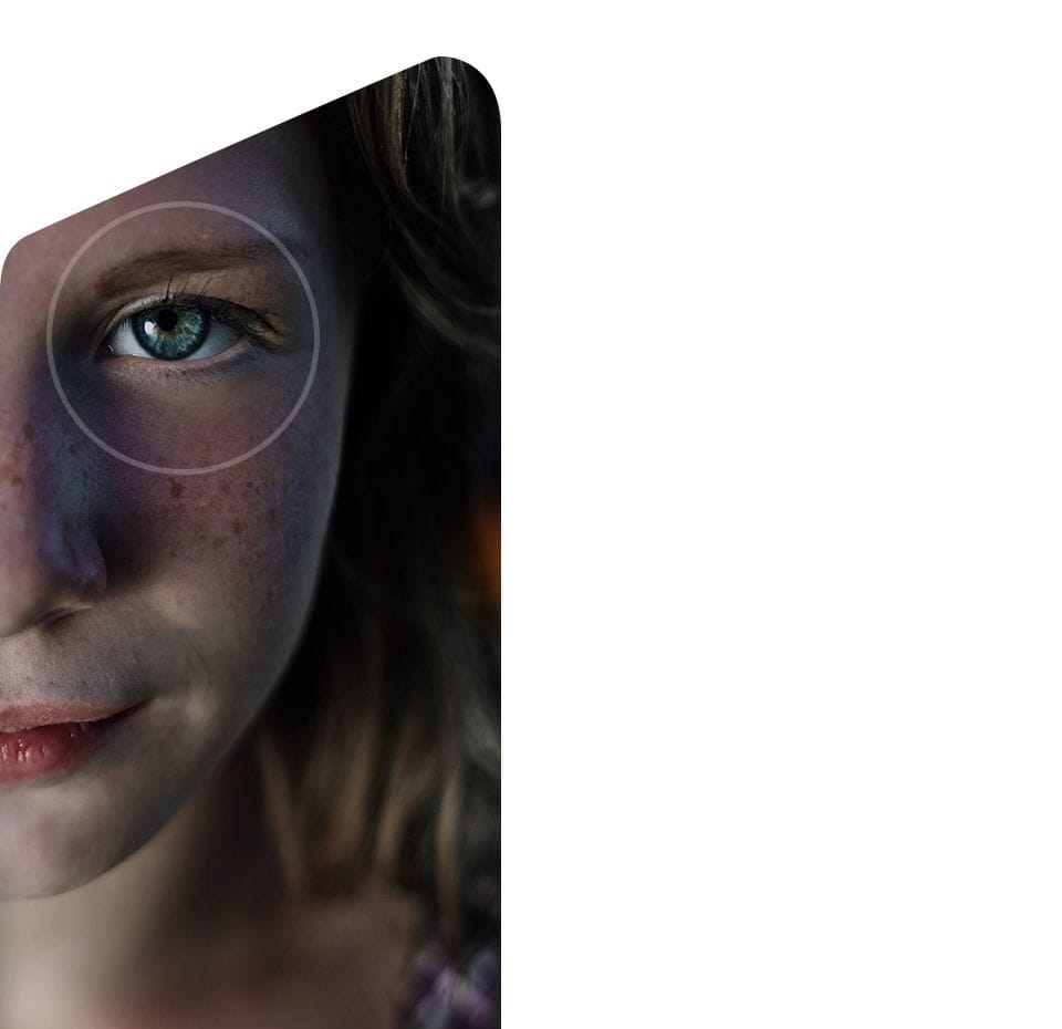Person’s face with illustrated overlays depicting face recognition and iris scan