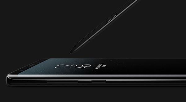 Left view of Great lying flat on surface with the S Pen angled toward the Galaxy Note8 screen