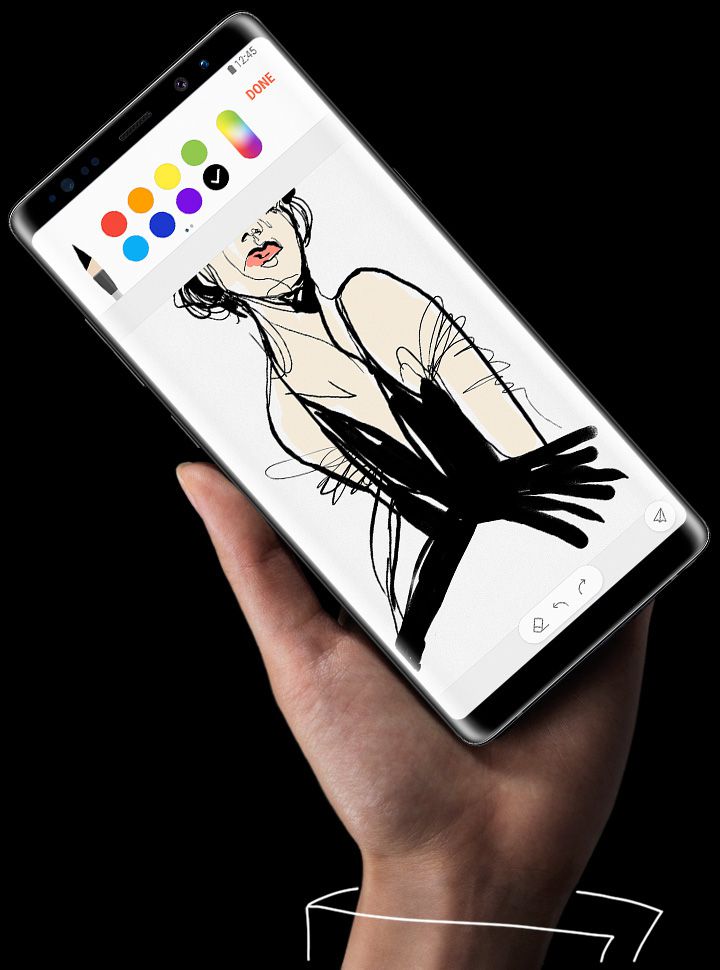 Hand holding Galaxy Note8 which has image of man in swimming pool with illustrations on it done with the S Pen.