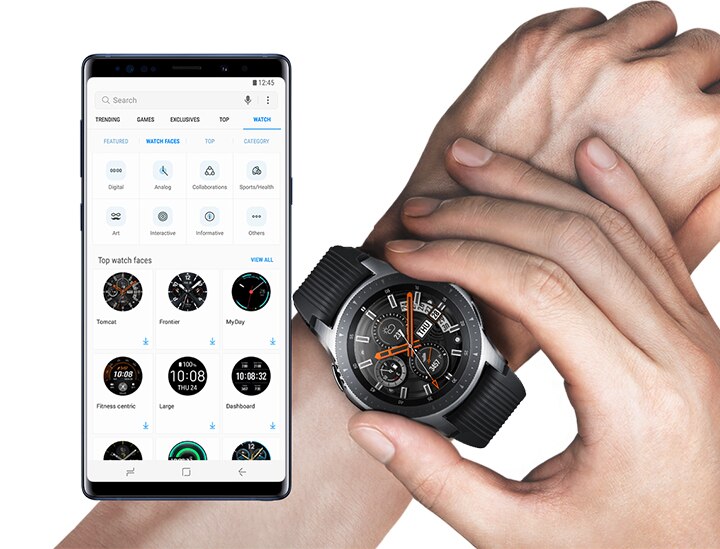 A front view of Galaxy Note9 Ocean Blue running the menu for the watch face app download in Galaxy Apps and an animated image of a person’s left wrist wearing a Galaxy Watch showing three types of watch face.