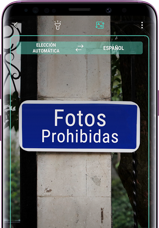 Galaxy S9+ mostrando un cartel traducido con el signo sin traducir en el fondo