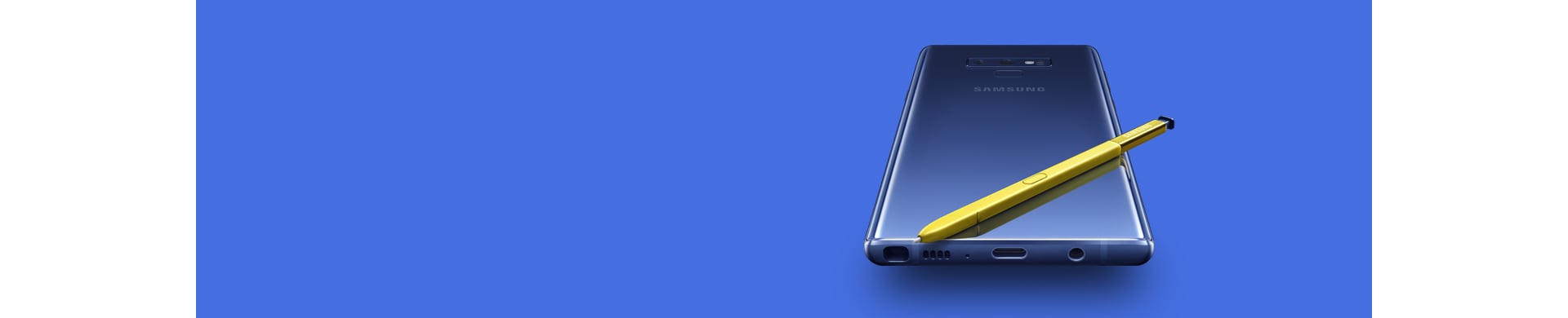  Galaxy Note9 azul-marinho com o ecrã para baixo com S Pen amarela no topo, visto de baixo